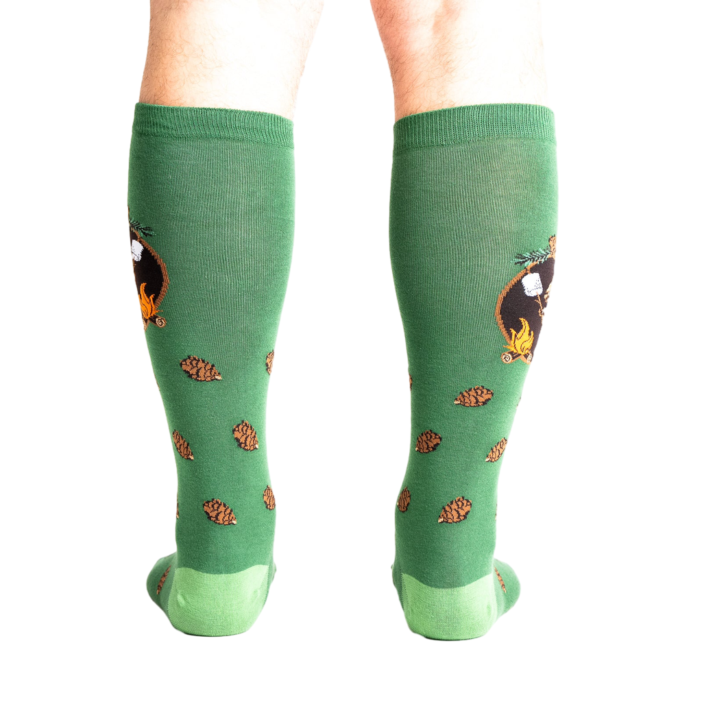 Rear view of a person wearing the 'S'more Where That Came From' knee-high socks, showing the full design on both socks.