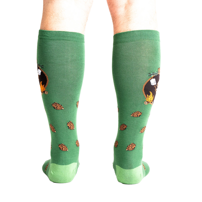 Rear view of a person wearing the 'S'more Where That Came From' knee-high socks, showing the full design on both socks.