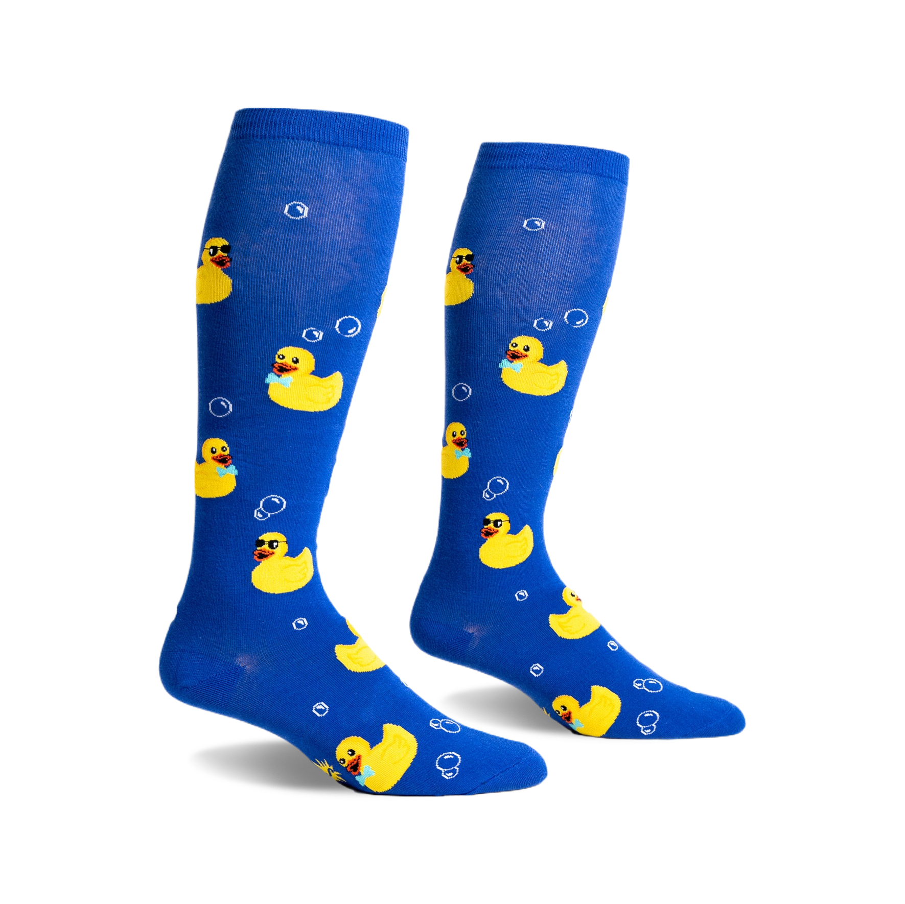 Pair of blue knee-high socks with yellow rubber duckies wearing sunglasses and bow ties, and white bubbles printed on them.