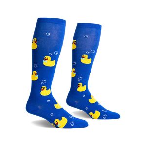 Pair of blue knee-high socks with yellow rubber duckies wearing sunglasses and bow ties, and white bubbles printed on them.