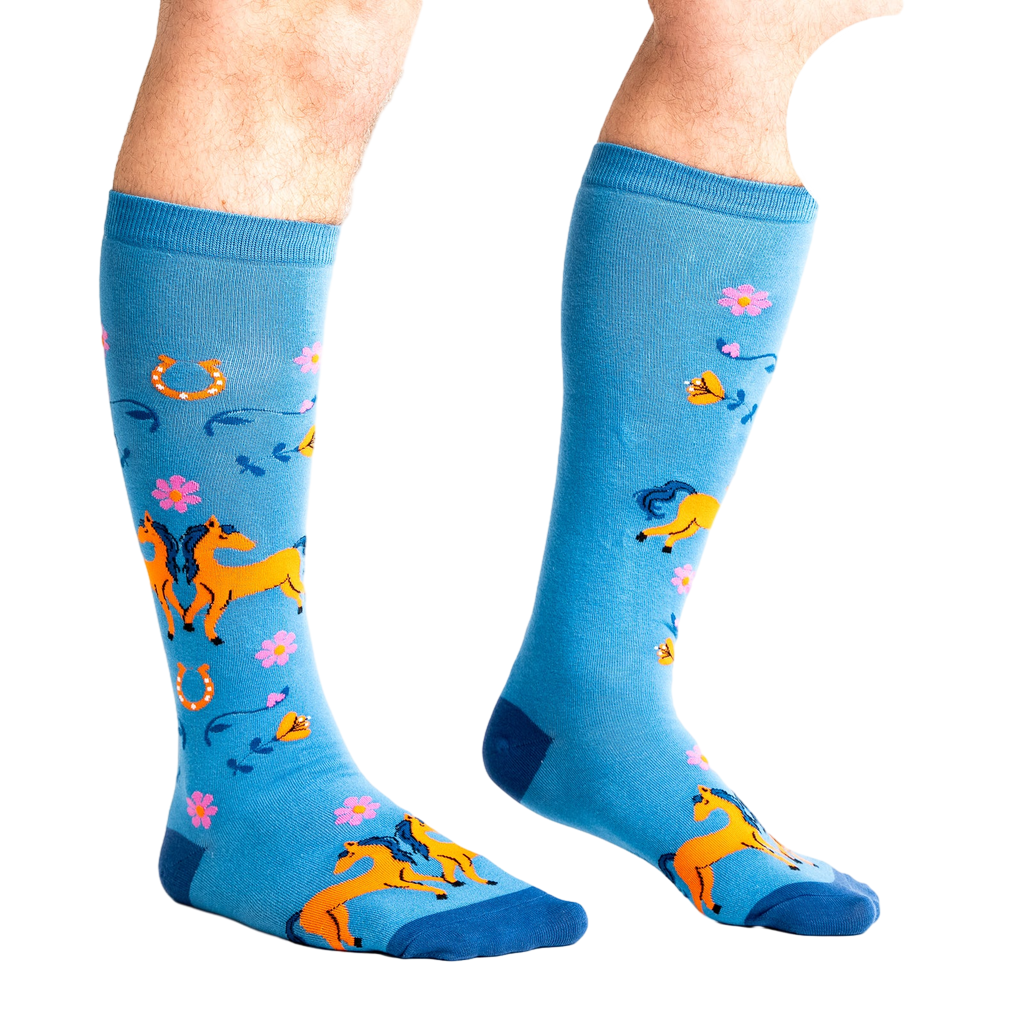 Lifestyle shot showing 'Hay There' socks on a person's legs, highlighting the extra stretch.