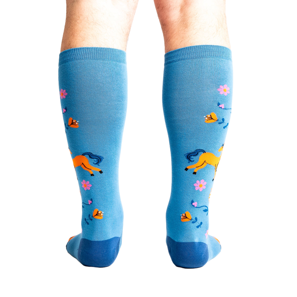 Rear view of model wearing the 'Hay There' socks, showcasing the design from behind.