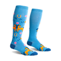 Pair of light blue knee-high socks with orange horses, pink flowers, and horseshoes. Fun, whimsical design.