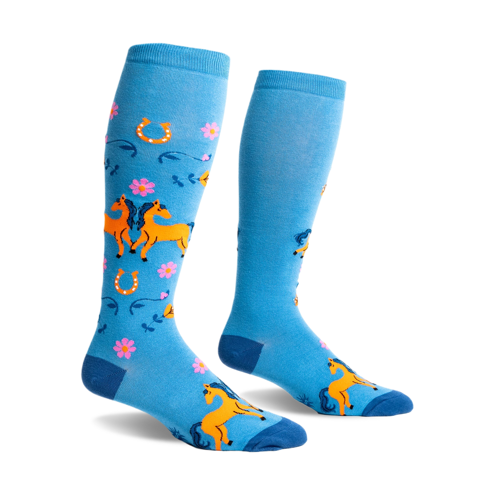 Pair of light blue knee-high socks with orange horses, pink flowers, and horseshoes. Fun, whimsical design.