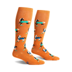 Pair of mustard yellow knee-high socks with a repeating pattern of horses wearing blue and black plaid blankets.
