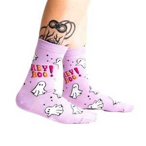 A person's tattooed legs wearing the light lavender 