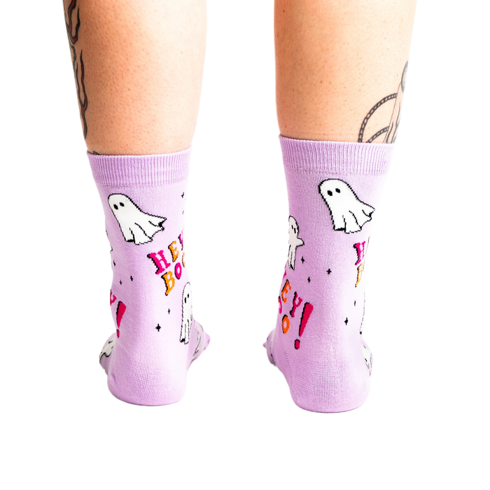 A back view of a person's legs wearing the light lavender ghost 