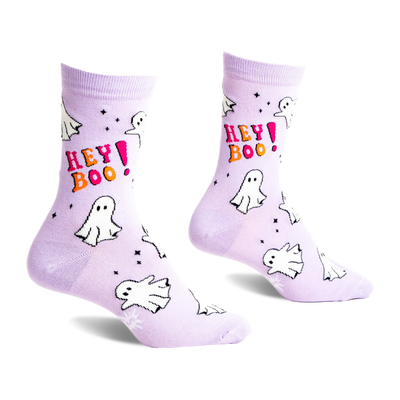 A pair of light lavender crew socks featuring white cartoon ghosts, pink and orange "HEY BOO!" text, and small black stars.