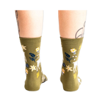 Back view of the socks on a model's legs, showcasing the design from a different angle.