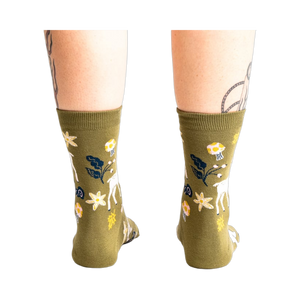 Back view of the socks on a model's legs, showcasing the design from a different angle.