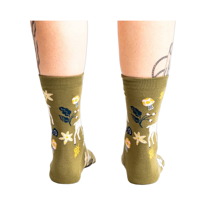 Back view of the socks on a model's legs, showcasing the design from a different angle.