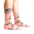Lifestyle shot of 'A Novel Idea' socks on a person's legs, showing how the socks look when worn.