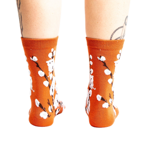 Back view of the Kitten Willow socks on a person's legs, showcasing the full sock design.