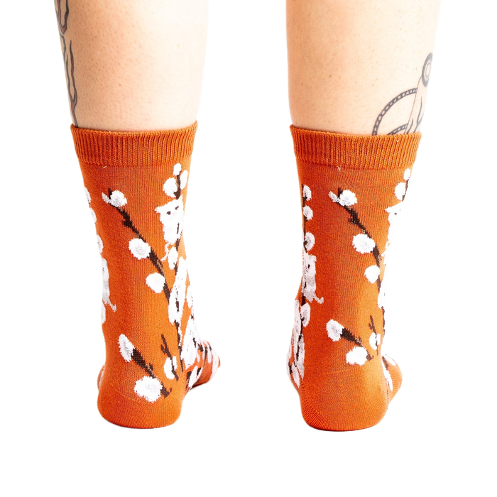 Back view of the Kitten Willow socks on a person's legs, showcasing the full sock design.