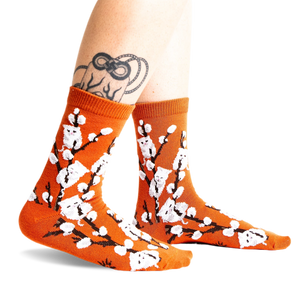 Lifestyle shot of the Kitten Willow socks on a model's legs, showing how they look when worn.