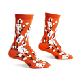 Pair of orange crew socks with a whimsical design featuring white kittens playfully perched on willow branches.