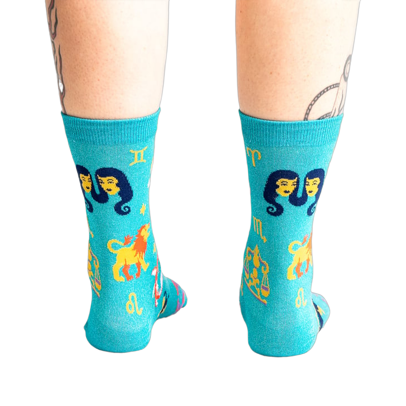 Back view of the teal zodiac socks, showcasing the design's full coverage.