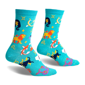 front view of a pair of teal blue socks with zodiac symbols. the socks have a glitter finish.  the socks feature a yellow lion, a purple scorpion, a pink fish, a white fish, a yellow archer and a blue and yellow gemini symbol on them.  the socks have a yellow 