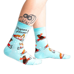 Lifestyle shot of Powder Hound socks on a person's legs, showing the socks' fit and style.