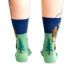 Rear view of the Sasquatch Campout socks on a model's legs.