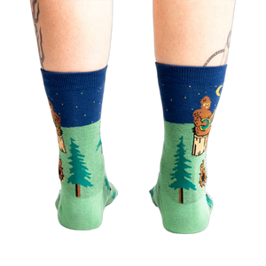 Rear view of the Sasquatch Campout socks on a model's legs.