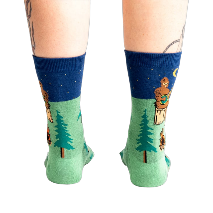 Rear view of the Sasquatch Campout socks on a model's legs.