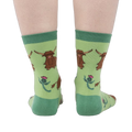 Rear view of the socks on a person's feet, giving a full view of the pattern.