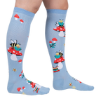 Lifestyle shot showing the socks on a person's legs, showcasing the fit and overall design.