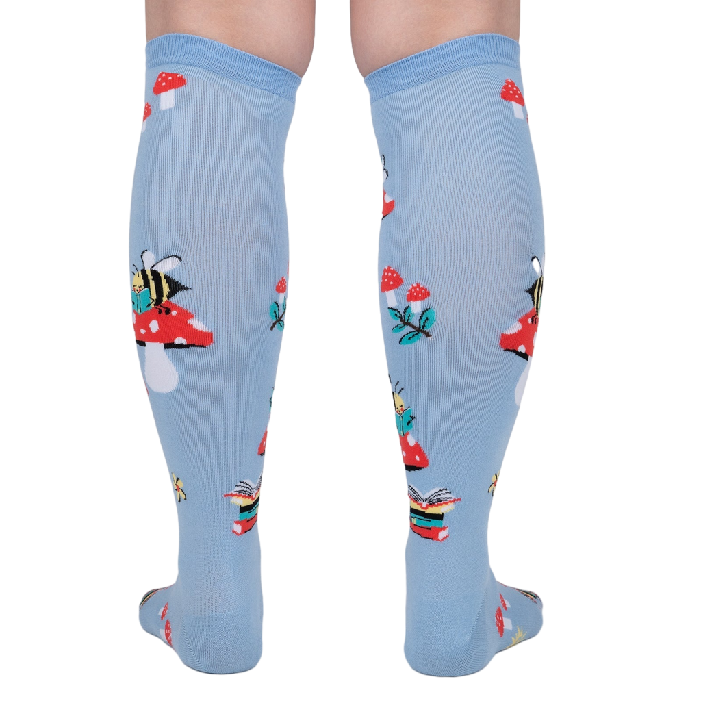 Rear view of the socks on a person's legs, highlighting the back pattern and design.