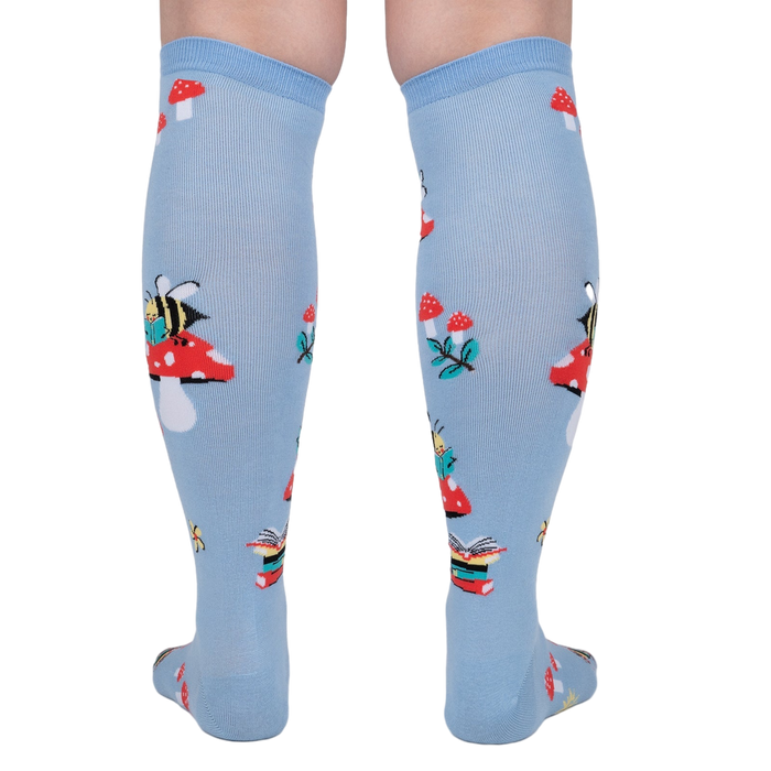 Rear view of the socks on a person's legs, highlighting the back pattern and design.