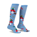 Pair of light blue knee-high socks with a whimsical design featuring bees reading books perched on red mushrooms.