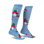 Pair of light blue knee-high socks with a whimsical design featuring bees reading books perched on red mushrooms.