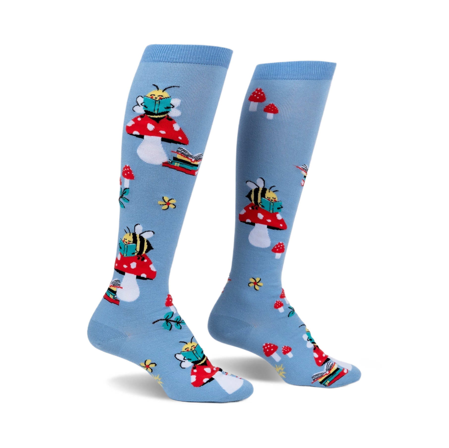 Pair of light blue knee-high socks with a whimsical design featuring bees reading books perched on red mushrooms.