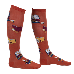 Lifestyle shot: Person wearing burnt orange True Crime knee-high socks.