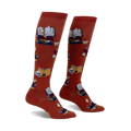 Pair of burnt orange knee-high socks featuring a repeating pattern of books, magnifying glasses, and skulls.