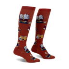 Pair of burnt orange knee-high socks featuring a repeating pattern of books, magnifying glasses, and skulls.