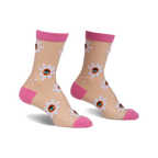 Pair of women's sheer socks in nude with pink cuffs.  White daisies with eye details are printed on the sheer fabric.