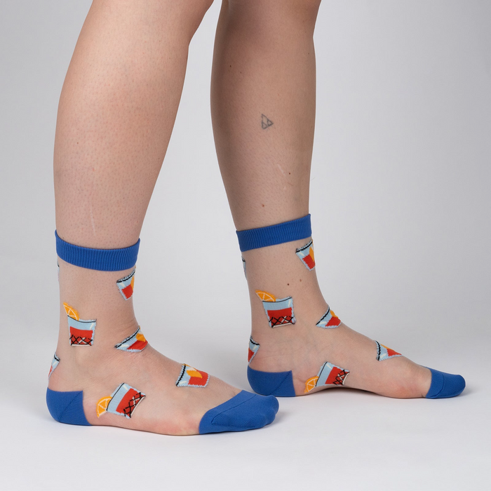 Lifestyle shot showing the socks on a person's legs against a white background.