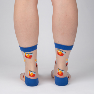 Rear view of the socks on a person's legs; showcases the sock's design and fit from the back.