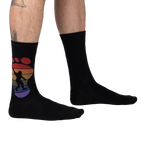Lifestyle shot showing the 'Squatch and Learn' socks on a person's feet, showcasing the fit and design.