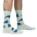 Lifestyle shot: Model's legs wearing the 'And I Will Walrus Love You' socks, showcasing fit and style.
