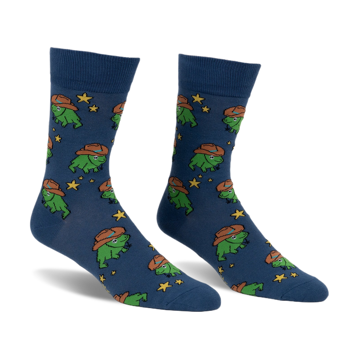 Pair of crew socks in blue featuring a pattern of green frogs wearing cowboy hats and yellow stars.