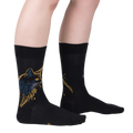 Lifestyle shot showcasing Night Cat socks on a model's legs, highlighting the sock's fit and design.