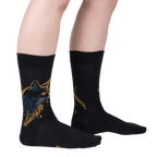 Lifestyle shot showcasing Night Cat socks on a model's legs, highlighting the sock's fit and design.