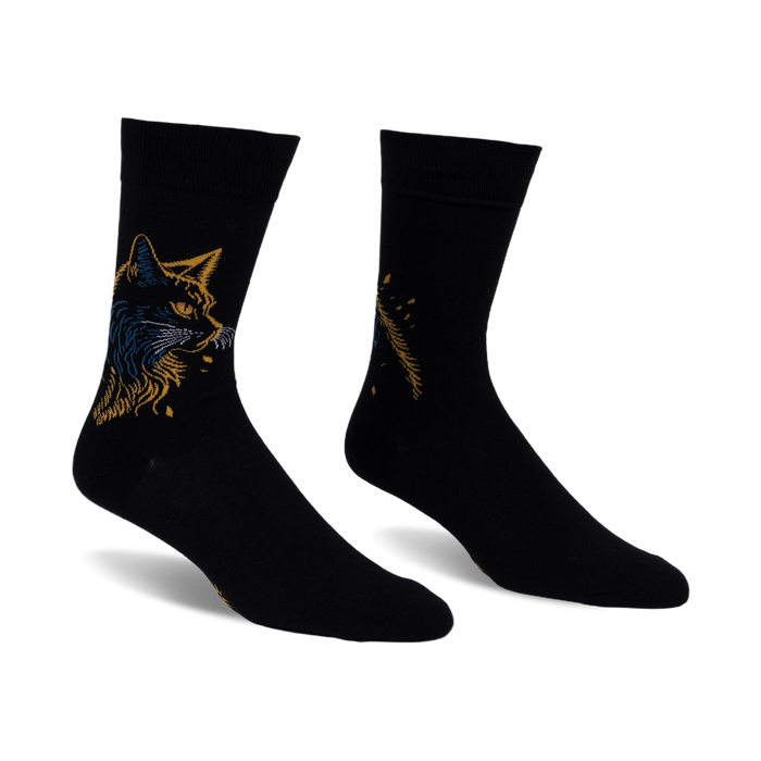 Pair of black crew socks with a detailed gold and blue cat design on one side and a complementary feather pattern on the other.