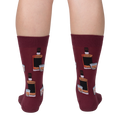 Rear view of the Whiskey Business socks on a person's legs.  Close up of the sock design on a burgundy background.