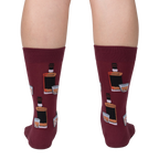 Rear view of the Whiskey Business socks on a person's legs.  Close up of the sock design on a burgundy background.