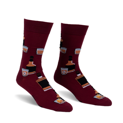 Pair of burgundy crew socks with a repeating pattern of whiskey bottles and glasses. Fun and stylish!
