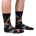 Lifestyle shot of a person wearing the 'Eye of the Tiger' socks, showcasing the design and fit.