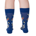 Rear view of 'Let it Bee' socks on a person's legs.  Shows the back of the sock design.